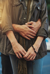 Hands, hug and security with couple closeup outdoor together for affection or love in summer....