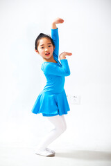 Little Asian girl dancing in blue clothes
