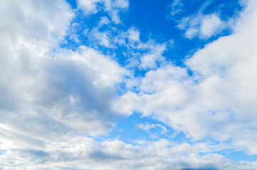 Sky landscape. Blue sky background with white dramatic colorful clouds in sunny day
