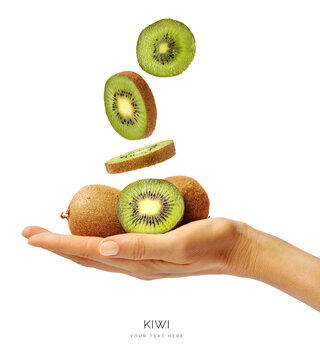 Creative layout made of a hand holding a kiwi on the white background. Food concept. Macro concept.