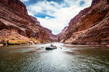 Rafting through the Grand Canyon National Park landscape with beautiful walls and mountains. Views of the Colorado River through the canyon valleys. River Trips © Yuxiao