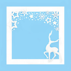 Christmas Eve reindeer fantasy frosted decoration with stars and snowflakes on blue background with...