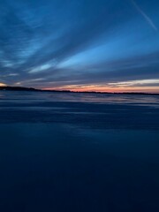 sunset over a frozen lake