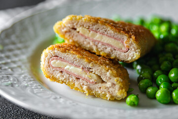 meat cutlet cordon bleu chicken, cheese, bacon meal snack on the table copy space food background rustic top view