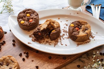 Delicious cookies on a plate, with one broken apart