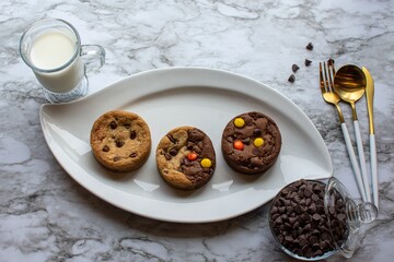 Cookies and milk on a fancy plate, on a marble