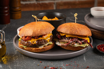 Two appetizing burgers with cutlet and brisket 