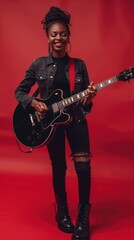 Fototapeta premium A woman joyfully strums a guitar, showcasing her musical talent in a vibrant setting