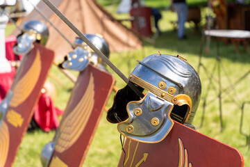 Ancient Roman legionary helmets on red legionary shields