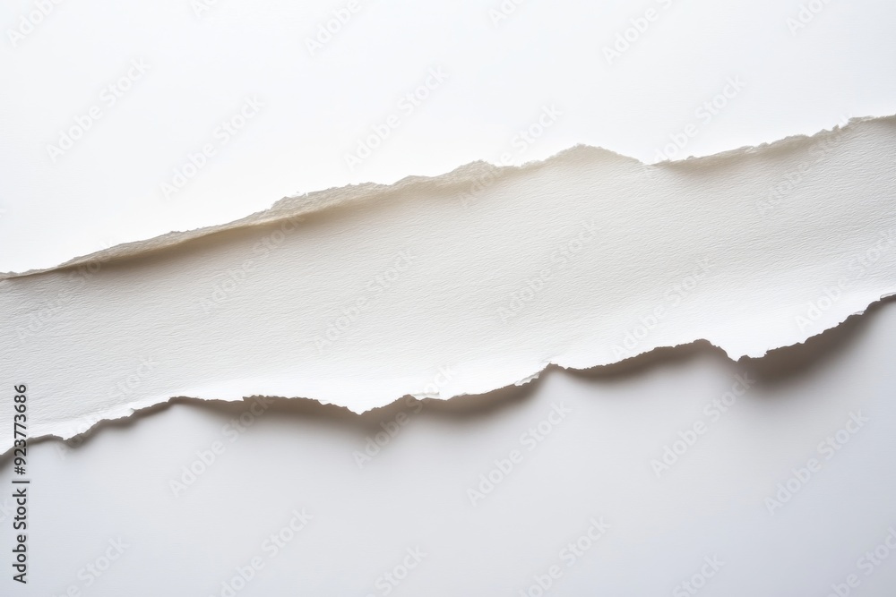 Poster a torn strip of paper reveals a sharp edge contrasting with a smooth white background, creating a cl