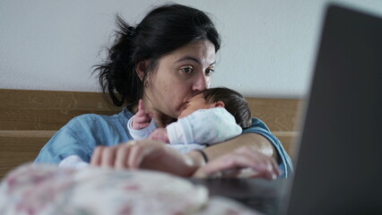 Woman multitasking with a laptop and newborn baby in a cozy bedroom setting, exemplifying the...