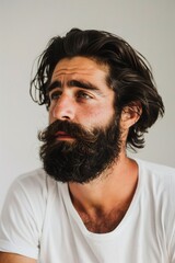 Obraz premium A Portrait of a man with a black thick beard and long