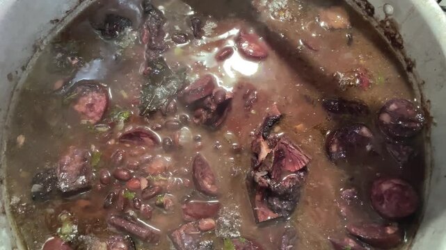 feijoada cooking in the pan. Typical Brazilian food