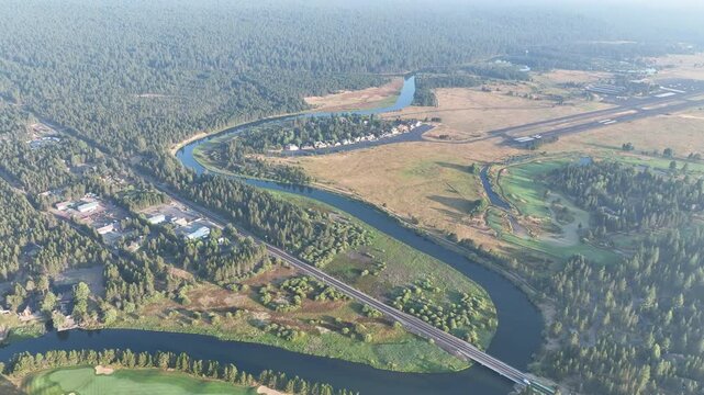 The beautiful Deschutes River winds through the rural landscape near Sunriver, Oregon. This area, in the foothills of the Cascade Mountains, is a popular vacation destination in the summer and winter.