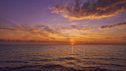 Serene Seaview with a Stunning Purple, Orange, and Yellow Sunset
