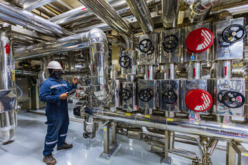 Male work inspection process valve at the insulation in process area of pipeline flowing stainless...
