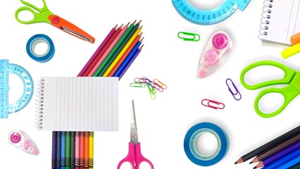 Top view of a variety of school supplies arranged neatly on a white background, showcasing the back-to-school theme.