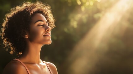 Serene African American Woman Enjoying Sunlight in Nature
