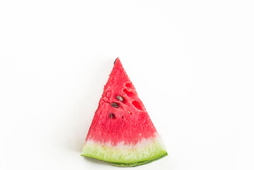 Slice of red ripe watermelon on a white background
