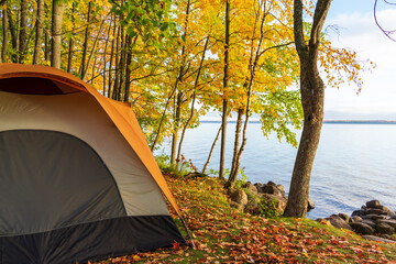Tent camping in fall at the lakeshore