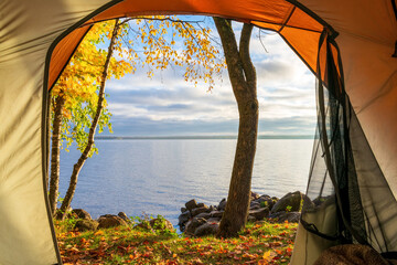 Tent camping on a lake in autumn