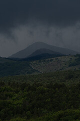 Fototapeta premium Dark storm clouds hang threateningly over the Croatian mountains.