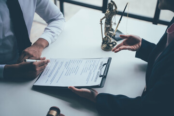 Legal Counsel and Agreement: A client and lawyer engage in a serious discussion, reviewing legal...