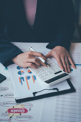 Accounting businessman calculates financial figures and plans a budget. financial concept
