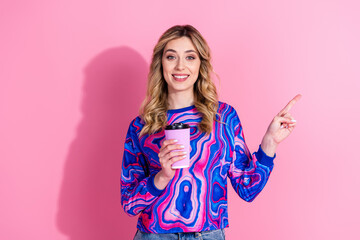 Photo of gorgeous blonde curly hair lady wearing bright stylish sweatshirt direct finger coffee shop isolated on pink color background