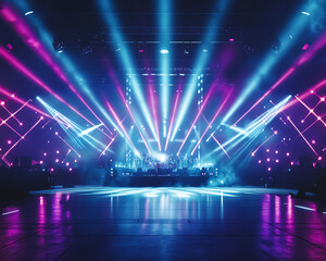 Stage lights illuminate a concert venue with vibrant blue and pink beams.