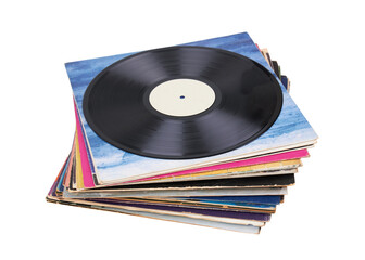 Fototapeta premium Vinyl record on a stack paper envelopes. Analog sound. Classic audio. Isolated on white