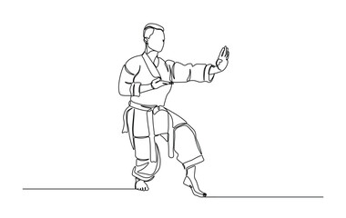 One continuous line drawing karateka fighter in kimono practicing karate kick combat. Karateka sport single line illustration.