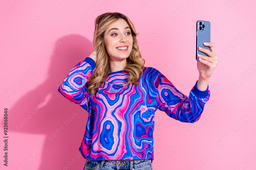 Sticker Portrait photo of blonde curly hair lady wearing bright stylish sweatshirt using phone recording vlog video isolated on pink color background