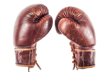 Obraz premium Vintage brown leather boxing gloves, well-worn and full of character, representing the history of boxing. 