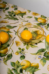 Fresh Lemons on White Background with Patterned Tablecloth