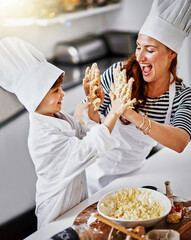 Kitchen, playful woman and dirty high five, baking and learning with dough, prepare ingredients or culinary skills. Mother, home and kid for joy, cooking and child development for recipe or breakfast