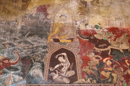 Remarkable Mural Painting of Phra Mae Thorani Goddess Twisting her Hair above the Door inside the Old Ordination Hall of Wat Chomphuwek Buddhist Temple, Nonthaburi, Thailand
