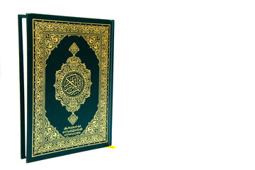 a hand pointing to the Muslim holy book al quran isolated on a white background with