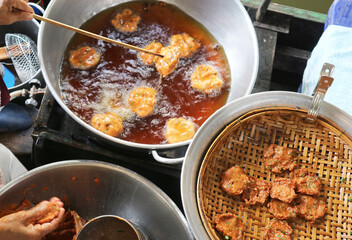 Vendor Cooking and Selling Thai Fish Cake or Tod Mun Pla on the Floating Market in Thailand