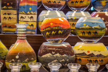 Extreme close up of sand art in the bottle from United Arab Emirates. Popular gift souvenirs from the middle east.