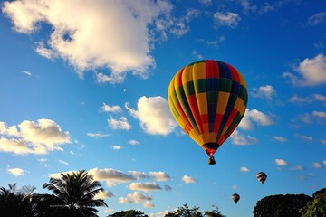 Fototapeta premium A cluster of colorful hot air balloons soaring through a clear blue sky