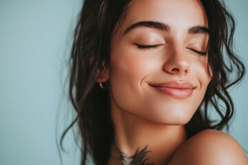 Naklejka premium A close up of a woman's face with tattoos and her eyes closed