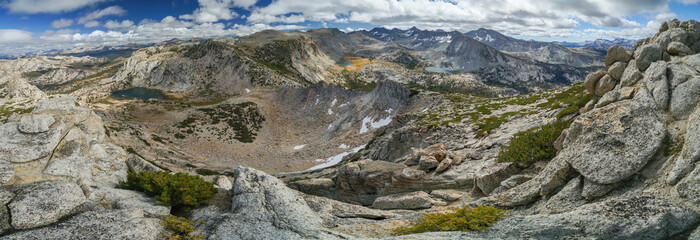 A panoramic view of a mountain range with a large crater in the middle