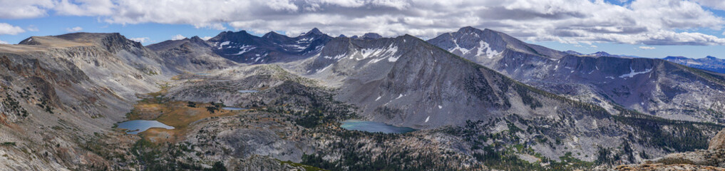 A mountain range with a lake in the foreground