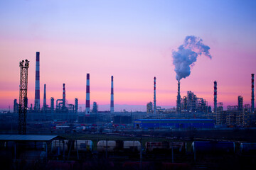 Working oil refinery. Smoke from the factory chimney. Ecological pollution. Air emissions polluting...