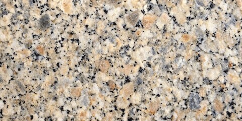 Natural Granite Texture - Warm Hues and Fine Grain. A closeup image of polished granite featuring a warm palette of beige, cream, and black in a fine-grained pattern. Ideal for backgrounds, textures.