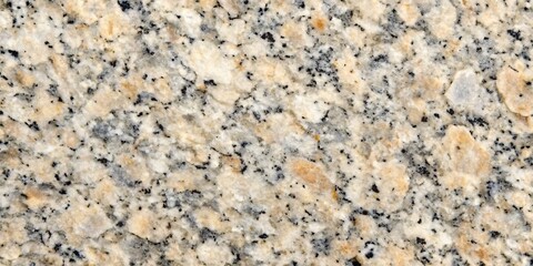 Natural Granite Texture - Warm Hues and Fine Grain. A closeup image of polished granite featuring a warm palette of beige, cream, and black in a fine-grained pattern. Ideal for backgrounds, textures.