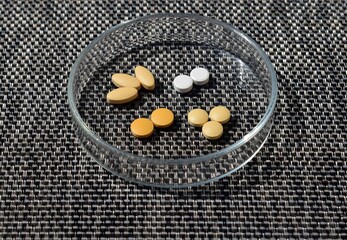 Different pills in a petri dish 