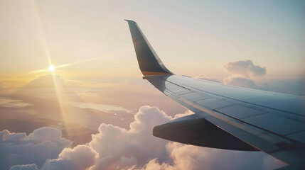 Close-up of an airplane's wing from the window seat perspective, with the winglet and sky in the background