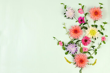 Abstract floral arrangement, Flowers dahlias, asters, buttercups on light background, flat lay. Autumn banner for advertising, rustic style, holiday card, selective focus..